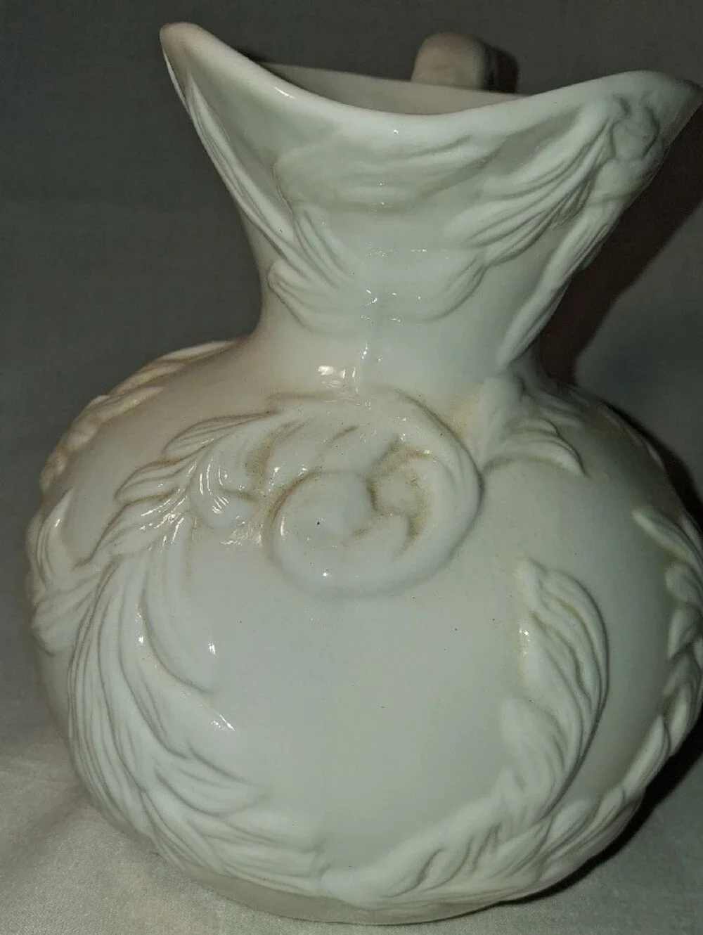 Vintage White Embossed Pitcher with Leaves/Vines Design Curved Handle